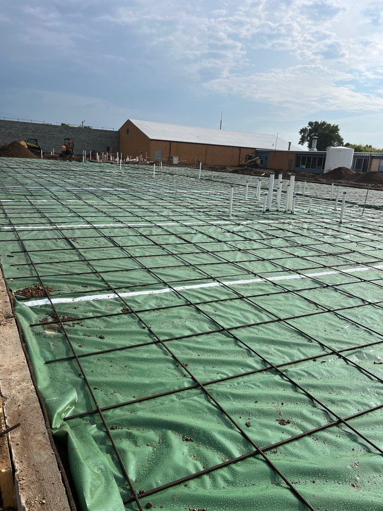 Prepared for concrete slab pour with the rebar and green vapor layer